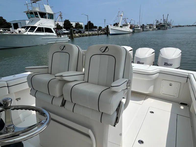 Slide: The Image of 2016 Jupiter 34 HFS boat with triple Yamaha F300 engines docked at marina. - 42