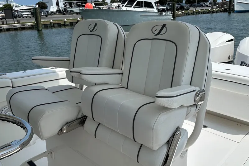 Slide: The Image of 2016 Jupiter 34 HFS boat seats with Triple Yamaha F300 engines at marina. - 43