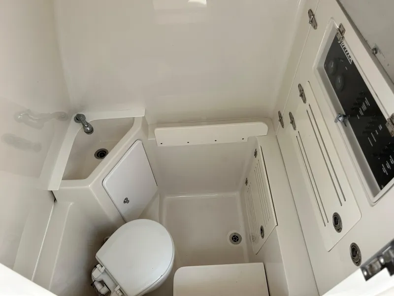Slide: The Image of Compact bathroom in 2016 Jupiter 34 HFS boat with sink and toilet. - 49