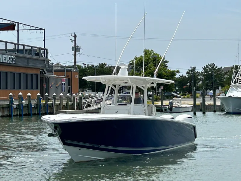 Slide: The Image of 2016 Jupiter 34 HFS boat with Triple Yamaha F300 engines on the water. - 6