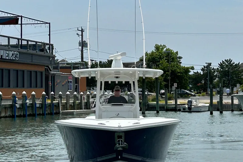 Slide: The Image of 2016 Jupiter 34 HFS boat with Triple Yamaha F300s in a marina. - 8