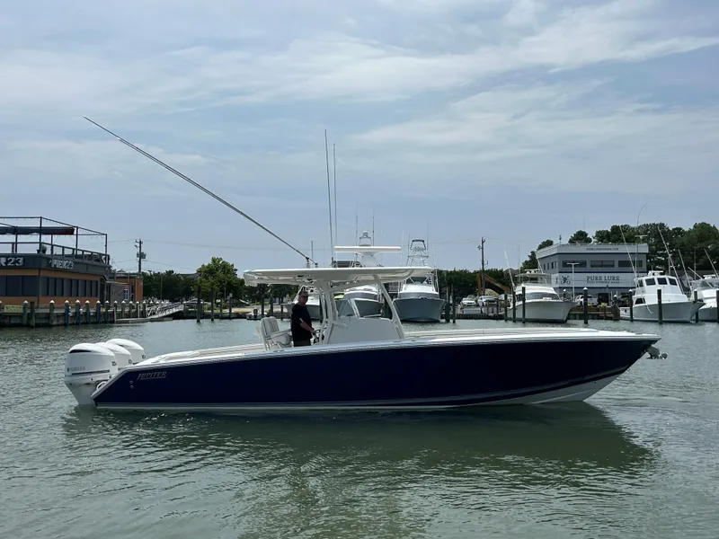 Slide: The Image of 2016 Jupiter 34 HFS boat with Triple Yamaha F300 engines on the water. - 9