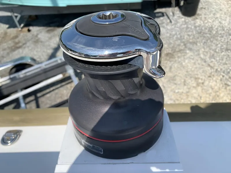 Slide: The Image of Winch on 2017 Sparkman & Stephens 30 sailboat, featuring a sleek chrome and black design. - 10