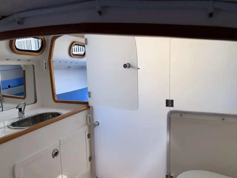 Slide: The Image of Interior of 2017 Sparkman & Stephens 30 yacht, featuring a compact bathroom and sink area. - 22