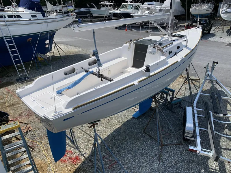 Slide: The Image of Sailboat on stands, Sparkman & Stephens 30, 2017 model, in a boatyard setting. - 4