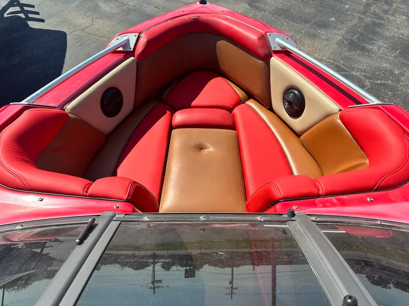 Slide: The Image of 2009 Supra 21V LAUNCH boat with red and tan interior seating. - 10