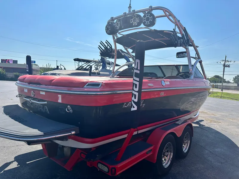 Slide: The Image of 2009 Supra 21V LAUNCH boat interior with red and tan leather seats. - 4