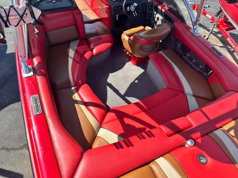 Slide: The Image of 2009 Supra 21V LAUNCH boat with red and tan seating. - 6