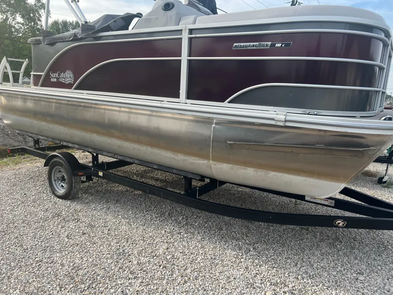 Slide: The Image of 2022 SunCatcher Select 18C pontoon boat on a trailer. - 5