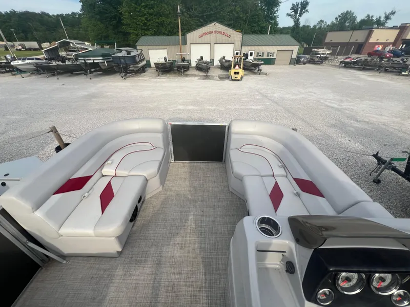 Slide: The Image of 2022 SunCatcher Select 18C pontoon boat with spacious seating and modern dashboard. - 6