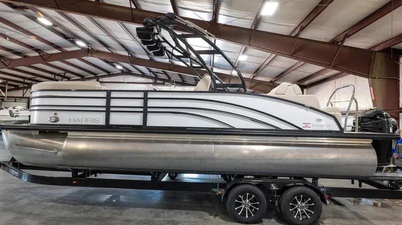 The Image of 2021 Harris SUNLINER 230 SLDH pontoon boat in indoor storage. - 1