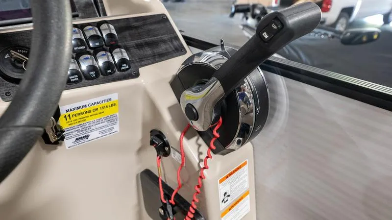 Slide: The Image of Control panel and throttle of a 2021 Harris SUNLINER 230 SLDH boat. - 13