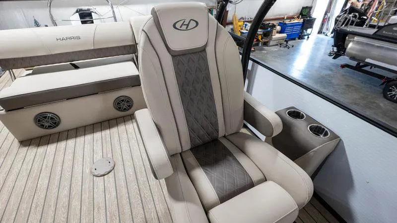 Slide: The Image of Captain's chair on 2021 Harris SUNLINER 230 SLDH pontoon boat in a workshop. - 17