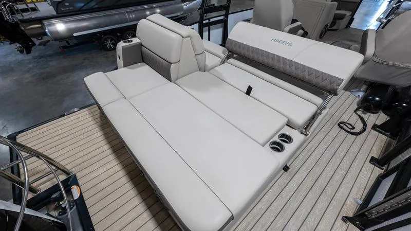 Slide: The Image of 2021 Harris SUNLINER 230 SLDH boat interior with spacious seating and cup holders. - 18