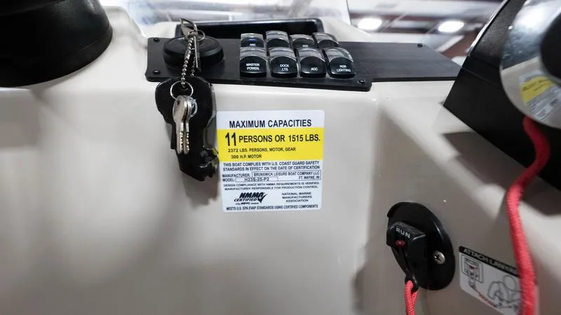 Slide: The Image of Control panel of 2021 Harris SUNLINER 230 SLDH with capacity label and keys. - 21
