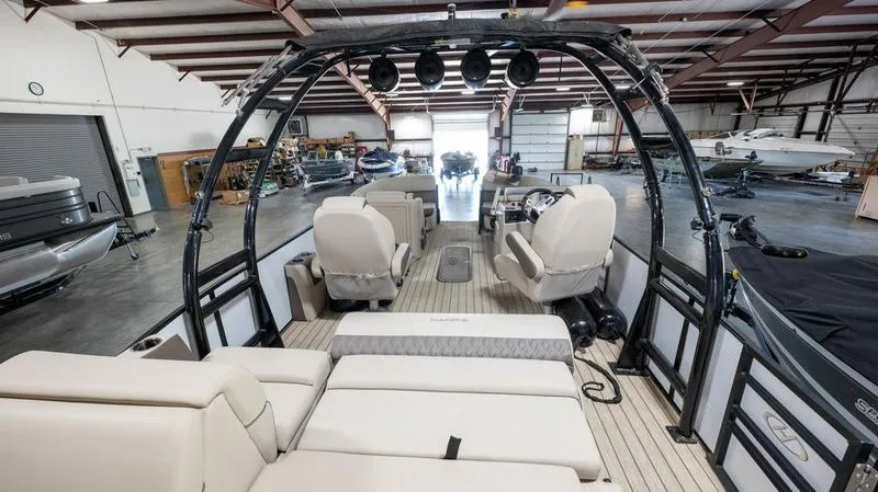 Slide: The Image of 2021 Harris SUNLINER 230 SLDH pontoon boat interior in a warehouse. - 22