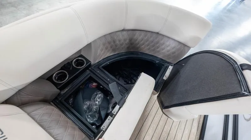 Slide: The Image of 2021 Harris SUNLINER 230 SLDH boat interior storage compartment with cup holders. - 26