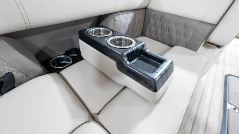 Slide: The Image of 2021 Harris SUNLINER 230 SLDH boat interior with cup holders and beige seating. - 29