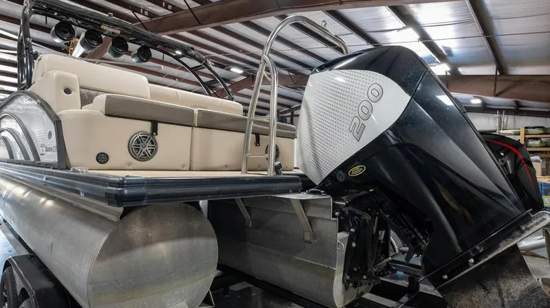 Slide: The Image of 2021 Harris SUNLINER 230 SLDH pontoon boat with 200 HP engine in a warehouse. - 35