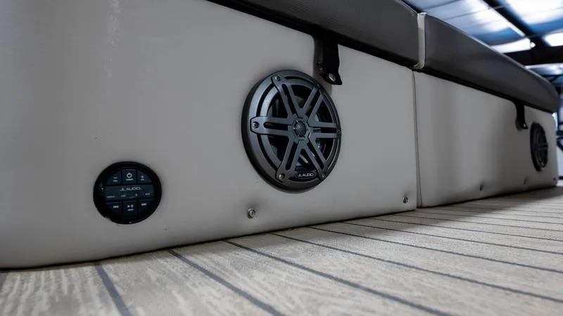 Slide: The Image of 2021 Harris SUNLINER 230 SLDH boat interior with JL Audio speakers and control panel. - 36