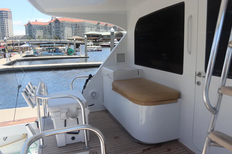 Slide: The Image of 2003 Hatteras 70 Convertible yacht deck with marina view. - 15