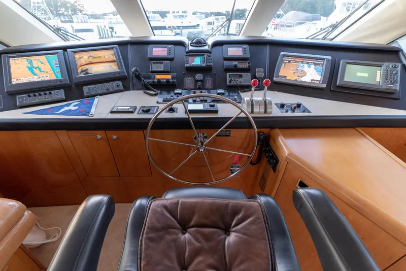 Slide: The Image of Helm station of 2003 Hatteras 70 Convertible yacht with advanced navigation systems. - 23