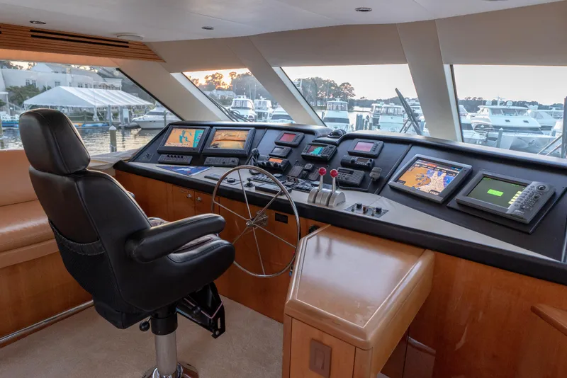 Slide: The Image of Helm station of 2003 Hatteras 70 Convertible yacht with advanced navigation systems. - 26