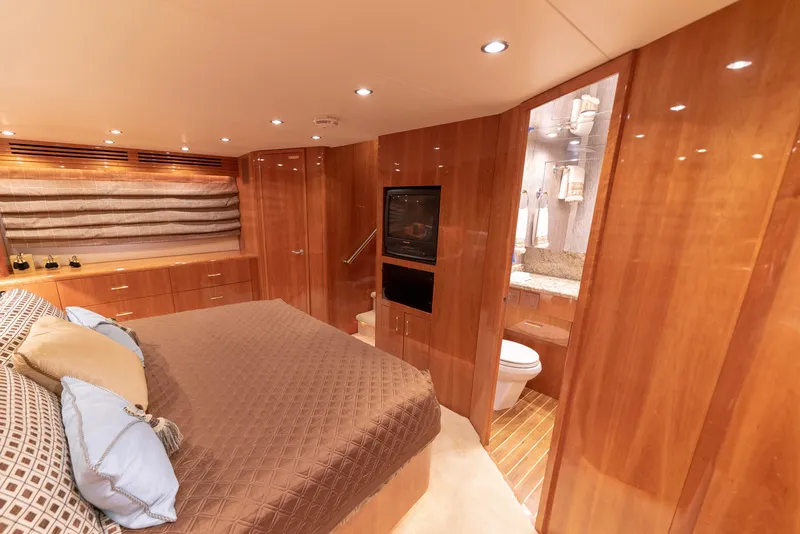 Slide: The Image of Luxurious master bedroom on 2003 Hatteras 70 Convertible yacht with ensuite bathroom. - 30