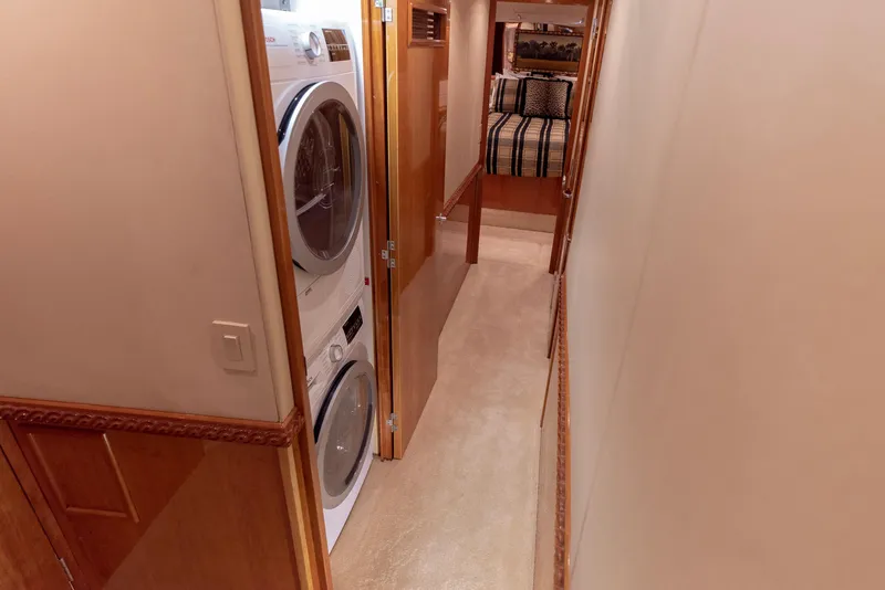 Slide: The Image of Laundry area and hallway in 2003 Hatteras 70 Convertible yacht. - 49