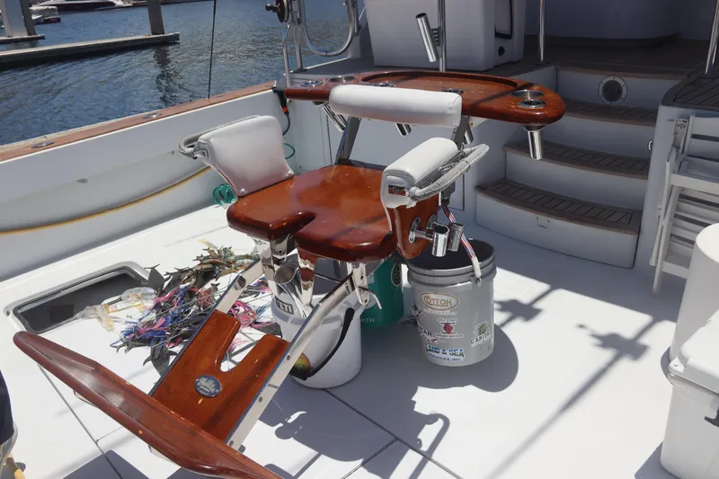 Slide: The Image of Fishing deck of a 2003 Hatteras 70 Convertible yacht with chair and equipment. - 9