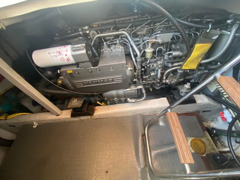 Slide: The Image of Engine compartment of a 2003 Sabre 36 boat, showcasing the engine and surrounding components. - 12