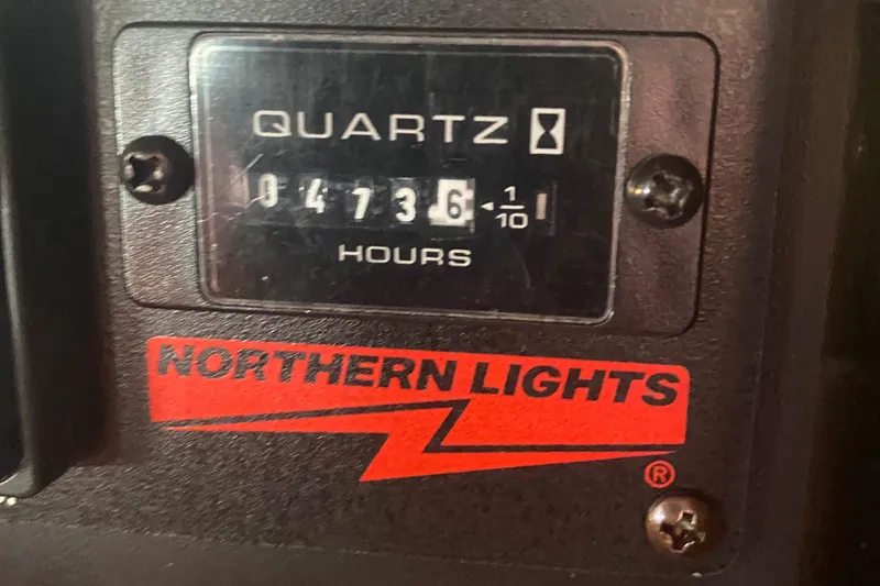 Slide: The Image of Hour meter on a 2003 Sabre 36 displaying 4736.1 hours, Northern Lights branding. - 15