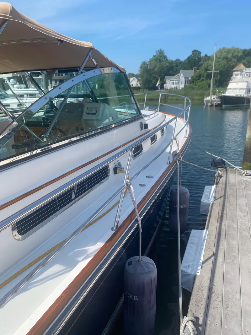 Slide: The Image of 2003 Sabre 36 yacht docked at a marina on a sunny day. - 2