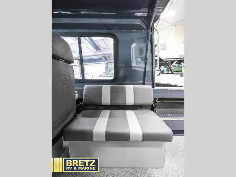 Slide: The Image of 2024 Sea Runner 190 ET HT interior seating at Bretz RV & Marine showroom. - 17