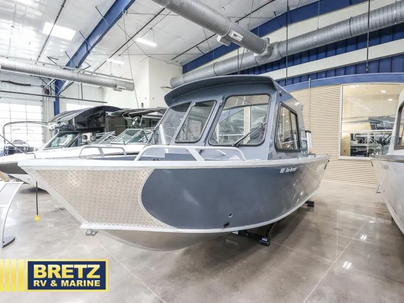 Slide: The Image of 2024 Sea Runner 190 ET HT boat displayed at Bretz RV & Marine showroom. - 3