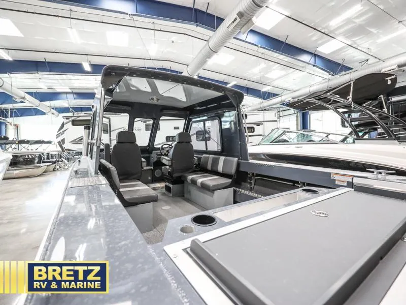 Slide: The Image of 2024 Sea Runner 190 ET HT boat interior at Bretz RV & Marine showroom. - 8