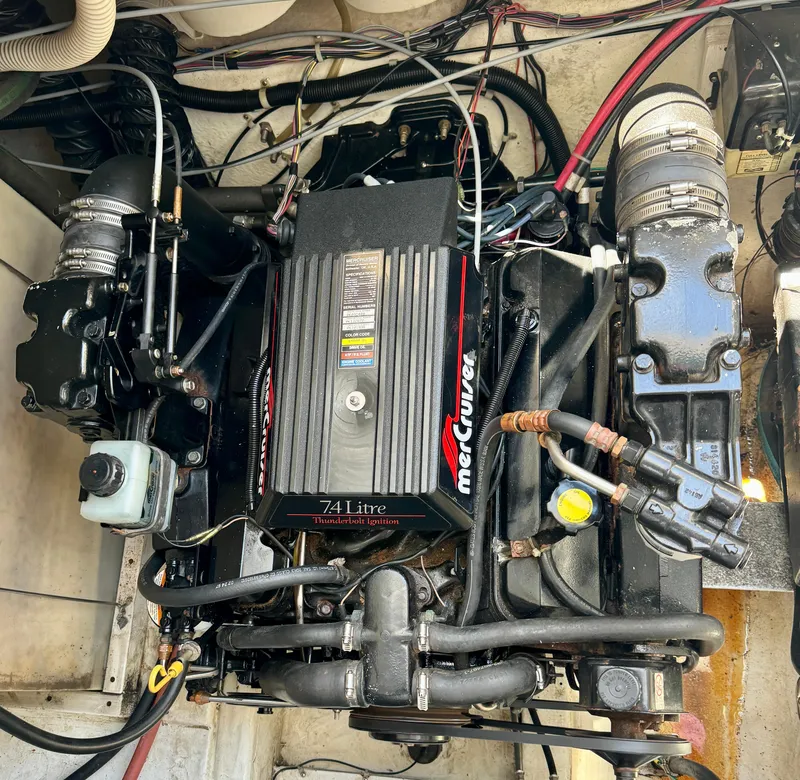 Slide: The Image of 1997 Maxum 3200 SCR engine compartment with a 7.4-liter MerCruiser engine. - 17