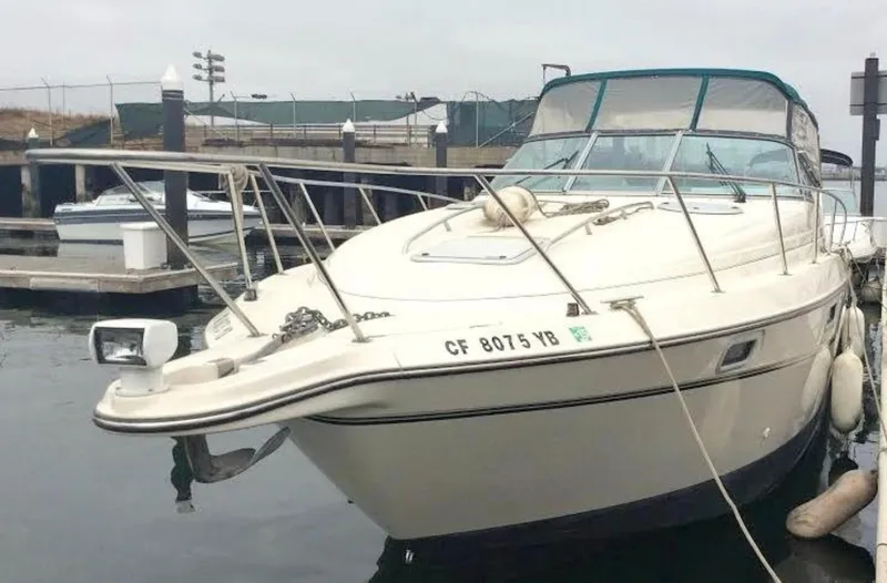 Slide: The Image of 1997 Maxum 3200 SCR boat docked at marina, front view. - 20
