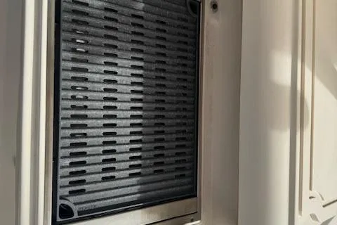 Slide: The Image of 2024 Grady-White Canyon 456 boat interior detail with vent grille. - 10