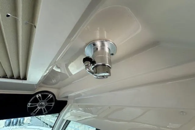Slide: The Image of 2024 Grady-White Canyon 456 boat interior with mounted speaker and light fixture. - 18