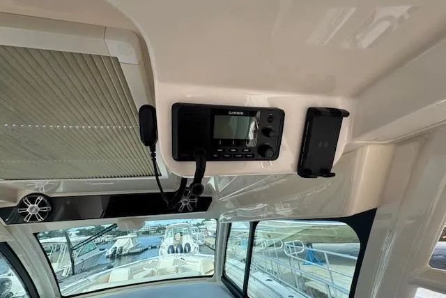 Slide: The Image of 2024 Grady-White Canyon 456 boat interior with Garmin radio and speaker system. - 19