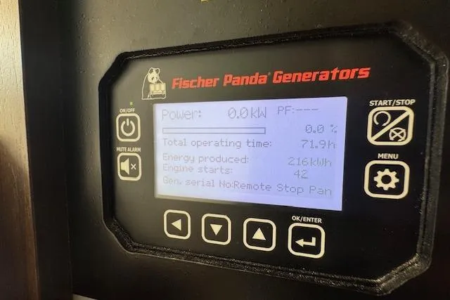 Slide: The Image of Fischer Panda generator display on 2024 Grady-White Canyon 456, showing power and operating stats. - 38