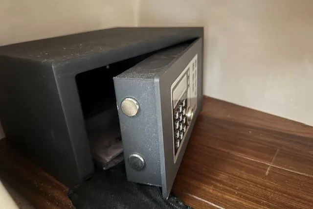 Slide: The Image of Open electronic safe on wooden shelf, showcasing security features. - 40