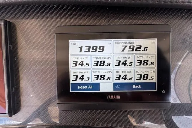 Slide: The Image of Yamaha display on 2024 Grady-White Canyon 456 showing trip data and engine hours. - 41