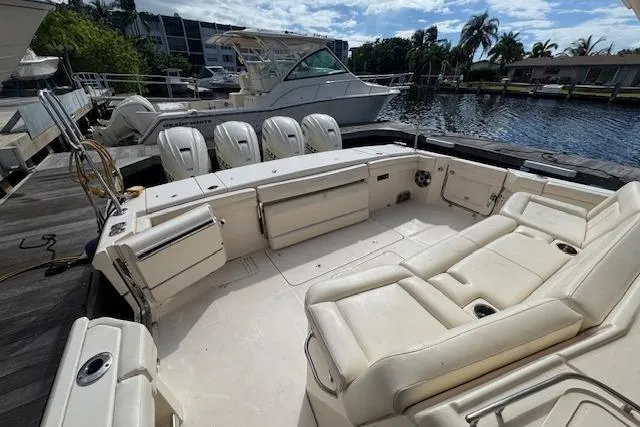 Slide: The Image of 2024 Grady-White Canyon 456 boat with spacious seating and four outboard engines. - 6