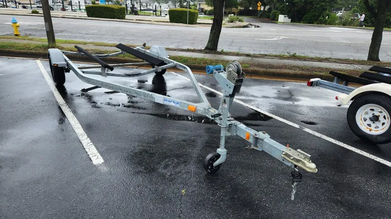 Slide: The Image of Boat trailer for 2015 Bayliner 175 Bowrider in parking lot. - 2