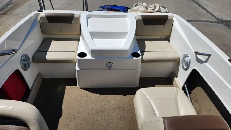 Slide: The Image of 2015 Bayliner 175 Bowrider interior seating area with beige upholstery. - 6