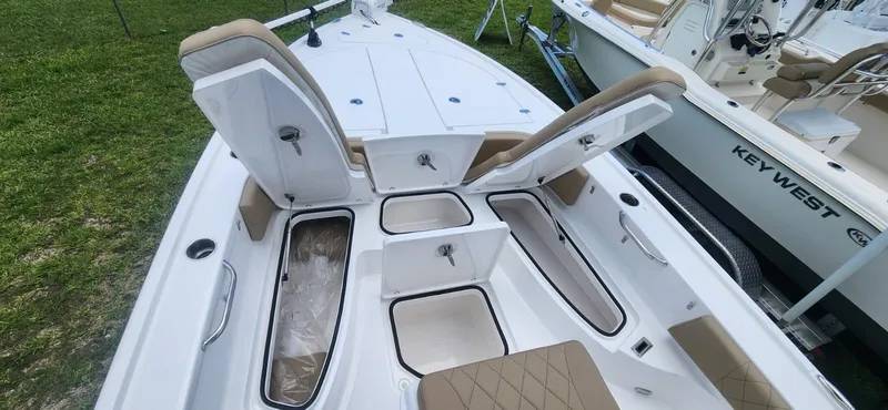 Slide: The Image of 2025 Blazer Bay 2440 boat interior with open storage compartments. - 7