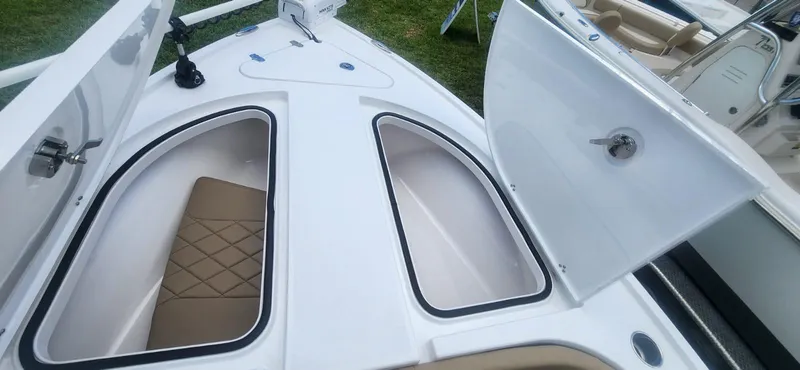 Slide: The Image of 2025 Blazer Bay 2440 boat storage compartments and seating. - 9