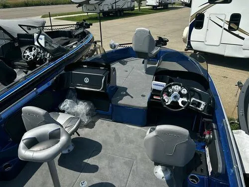 Slide: The Image of 2024 Nitro ZV19 Sport boat interior with seating and control console. - 7